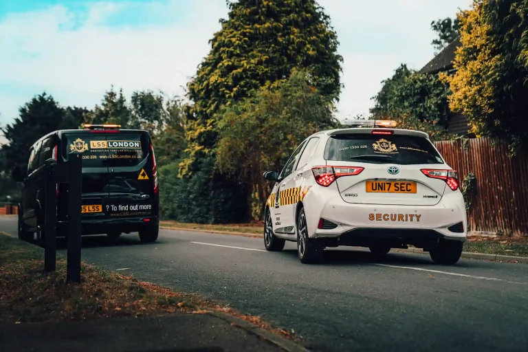 Residential security patrol vehicles operating in a Hertfordshire neighbourhood, delivering mobile security patrol and burglary prevention services.